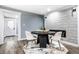 Dining area with a round table and chairs near a modern fireplace at 1621 Draper St, Indianapolis, IN 46203