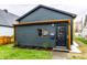 Charming dark gray home with copper gutters and well-manicured lawn at 1621 Draper St, Indianapolis, IN 46203