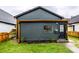 Dark gray exterior with copper accents and a neat front yard at 1621 Draper St, Indianapolis, IN 46203