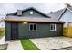 Rear view of house with dark-green siding and patio at 1621 Draper St, Indianapolis, IN 46203