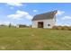 White barn with open doors and a smaller shelter nearby at 26735 Six Points Rd, Sheridan, IN 46069