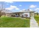 Covered patio with seating area, slide, and views of the surrounding fields at 26735 Six Points Rd, Sheridan, IN 46069
