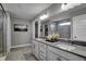 Elegant bathroom with double vanity, large mirror, and walk-in shower at 3628 Planck Cir, Danville, IN 46122