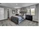 Well-lit bedroom with gray tones and ample closet space at 3628 Planck Cir, Danville, IN 46122