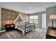 Charming bedroom with wood-paneled wall and comfortable bed at 3628 Planck Cir, Danville, IN 46122