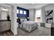 Spacious bedroom with a blue accent wall and en-suite bathroom at 3628 Planck Cir, Danville, IN 46122