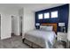 Bedroom with blue accent wall and en-suite bathroom at 3628 Planck Cir, Danville, IN 46122
