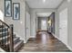 Bright foyer with hardwood floors, neutral walls, and staircase at 3628 Planck Cir, Danville, IN 46122