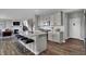 Modern kitchen with stainless steel appliances and an island with seating at 3628 Planck Cir, Danville, IN 46122