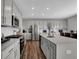 Modern kitchen with stainless steel appliances and an island with seating at 3628 Planck Cir, Danville, IN 46122