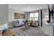 Cozy sitting area with sectional sofa and large window at 3628 Planck Cir, Danville, IN 46122