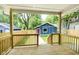 Deck overlooking a fenced backyard with detached garage at 408 W 11Th St, Anderson, IN 46016