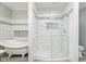 Elegant bathroom featuring a clawfoot tub and walk-in shower at 408 W 11Th St, Anderson, IN 46016