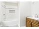 Clean bathroom with white tile shower and wood vanity at 408 W 11Th St, Anderson, IN 46016
