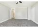 Spacious bedroom with gray carpet and ceiling fan at 408 W 11Th St, Anderson, IN 46016