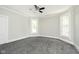 Large bedroom with gray carpet and ceiling fan at 408 W 11Th St, Anderson, IN 46016