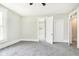 Bright bedroom with gray carpet and access to bathroom at 408 W 11Th St, Anderson, IN 46016