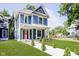 Stunning blue two-story house, nicely landscaped at 408 W 11Th St, Anderson, IN 46016