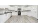 White kitchen with stainless steel appliances and granite countertops at 408 W 11Th St, Anderson, IN 46016