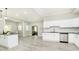 Open concept kitchen with island, stainless steel appliances, and dining area at 408 W 11Th St, Anderson, IN 46016