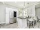 Kitchen features stainless steel appliances and an island with seating at 408 W 11Th St, Anderson, IN 46016