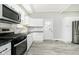 Updated kitchen with white cabinets, new appliances, and granite countertops at 408 W 11Th St, Anderson, IN 46016