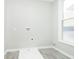 Laundry room with vinyl flooring and window at 408 W 11Th St, Anderson, IN 46016