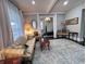 Light-filled living room with hardwood floors, view of staircase at 408 W 11Th St, Anderson, IN 46016