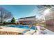 Inviting in-ground pool with a slide, surrounded by a deck and autumn foliage at 1160 Mt Vernon Dr, Greenwood, IN 46142