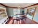 Formal dining room with hardwood floors and large window at 1160 Mt Vernon Dr, Greenwood, IN 46142