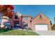 Brick house with two-car garage and autumn landscaping at 1160 Mt Vernon Dr, Greenwood, IN 46142