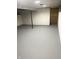 Spacious basement with painted concrete floor and exposed support beam at 1601 Draper St, Indianapolis, IN 46203