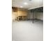 Unfinished basement area with painted concrete floor and wood framing at 1601 Draper St, Indianapolis, IN 46203