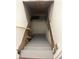 Stairs leading down to a clean, partially finished basement at 1601 Draper St, Indianapolis, IN 46203