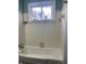 Bathroom with tub and shower, and off-white tile at 1601 Draper St, Indianapolis, IN 46203