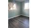 Bedroom with two windows and grey vinyl flooring at 1601 Draper St, Indianapolis, IN 46203