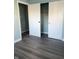 Bedroom with double door closet and grey vinyl flooring at 1601 Draper St, Indianapolis, IN 46203