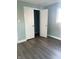 Bedroom with double door closet and wood-look flooring at 1601 Draper St, Indianapolis, IN 46203