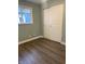 Bedroom with double door closet and wood-look flooring at 1601 Draper St, Indianapolis, IN 46203