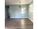 Simple dining area with hardwood floors and a chandelier at 1601 Draper St, Indianapolis, IN 46203