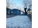 Large gravel backyard with a gray house in the background at 1601 Draper St, Indianapolis, IN 46203