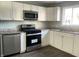 Updated kitchen with stainless steel appliances and granite countertops at 1601 Draper St, Indianapolis, IN 46203