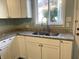 Modern kitchen with stainless steel sink and granite countertops at 1601 Draper St, Indianapolis, IN 46203