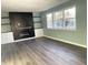 Modern fireplace with built-in shelving and white cabinets at 1601 Draper St, Indianapolis, IN 46203