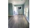 Bright living room with hardwood floors and a view of the backyard at 1601 Draper St, Indianapolis, IN 46203