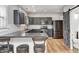 Modern kitchen with dark cabinets, concrete counters and breakfast bar at 400 E Hamilton Ave, Arcadia, IN 46030