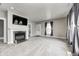 Spacious living room featuring a fireplace and large TV at 400 E Hamilton Ave, Arcadia, IN 46030