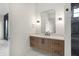 Modern bathroom with floating vanity, frameless shower, and marble flooring at 5035 Abington Way, Zionsville, IN 46077