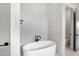 Relaxing bathroom with a free-standing bathtub and marble flooring at 5035 Abington Way, Zionsville, IN 46077