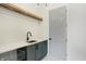 Laundry Room with gray cabinets and a farmhouse sink at 5035 Abington Way, Zionsville, IN 46077